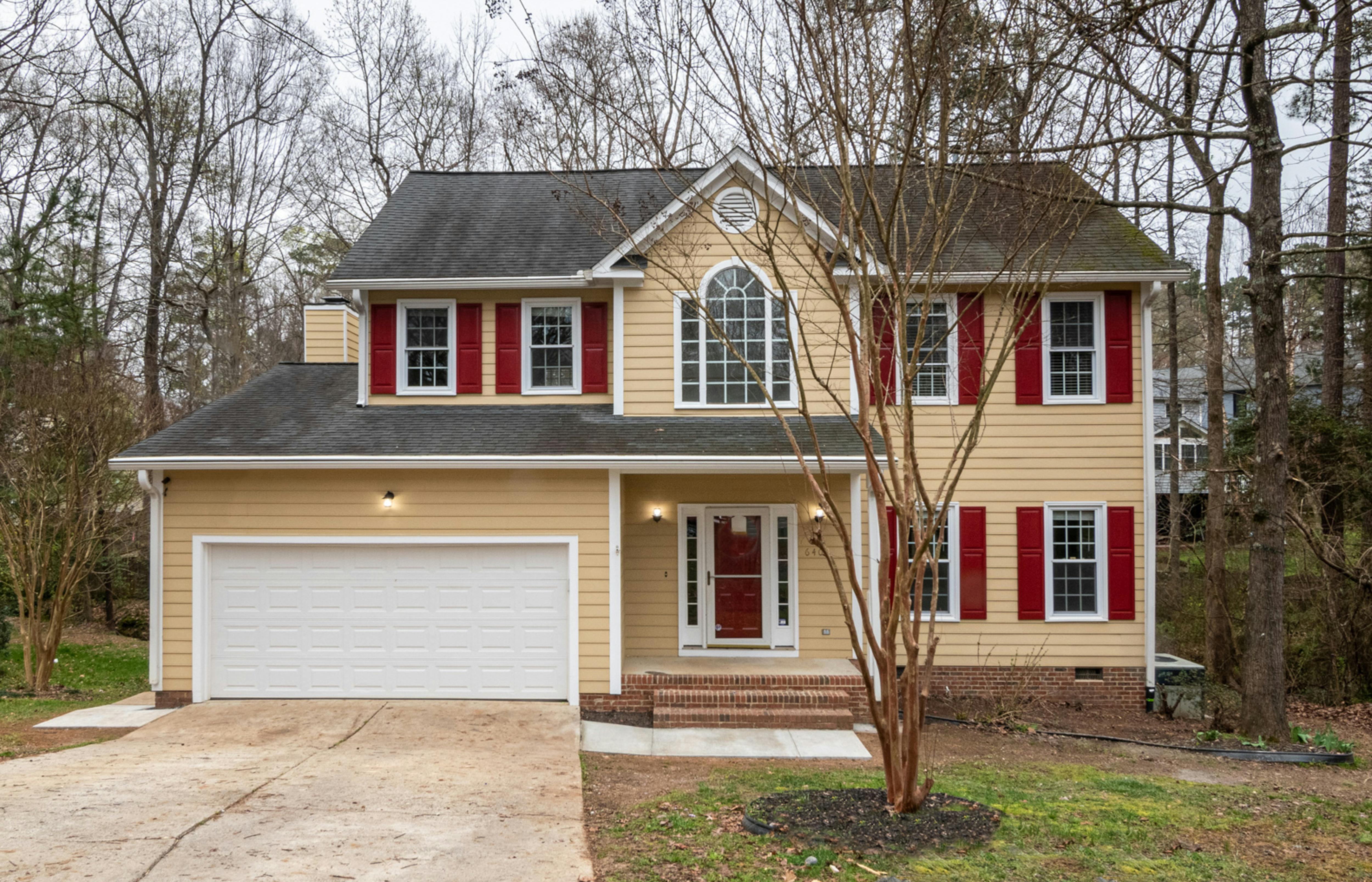 Traditional house with white garage door